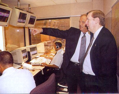 Brian Rice shows Jamie Borwick the dispatchers at work in the DaC call centre