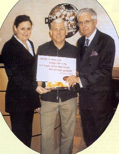 Allen Togwell presents John and Louise with their prize on behalf of Call Sign