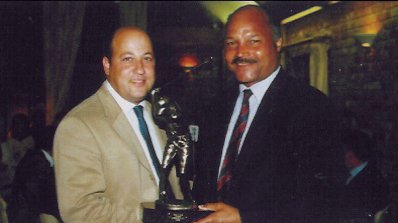 John Conteh presenting trophy to Kieth  Kyriacou