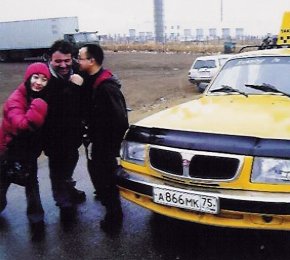 The Chinese competition winer Chung Chun and Scarlet (left) pose with Tony on their arrival in Irkustuk, Siberia