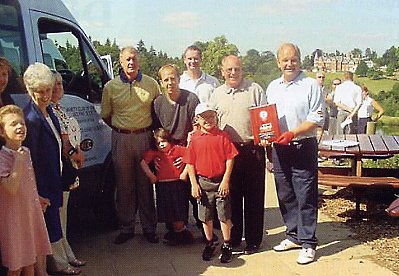 Brian Rice with Keith Andrews and Sir Geoff Hurst present the Sunshine Coach to the Shenstone School