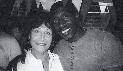 Celebrating the 40th anniversary of the button down shirt. Daphne Sherman with the former Olympic Linford Christie.