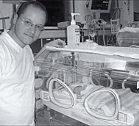 Stephen with the gorgeous albeit tiny baby Jack just after his birth. 