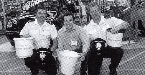 The local police with their appeal buckets at LTI vehicles Coventry Factory. 213 was raised from the collection.