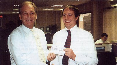 Presenting then-staff member Bradley MacDonald with Employee of the Year in 2000