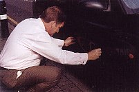 Lending a hand with a driver's logo fitting in 1998