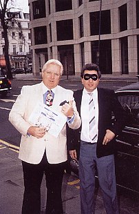 Mr X with wrestling manager Bobby 'The Brain' Heenan