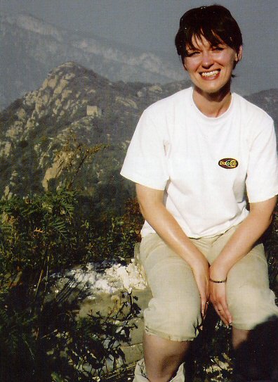 Kate relaxes in her DaC top with the mountains of China in the background.