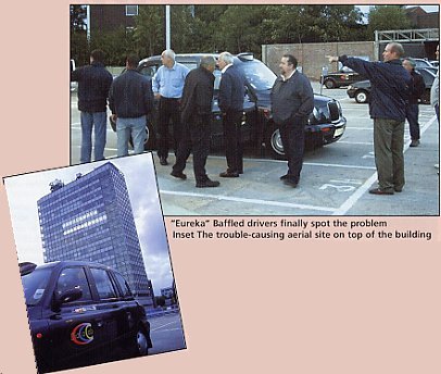 "Eureka" Baffled drivers finally sopt the problem. Inset: The trouble-causing aerial site on top of the building.
