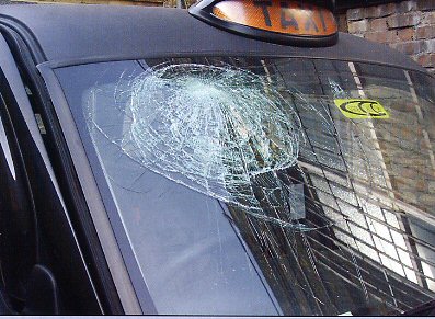 The imprint of Chas' head in the shattered windscreen