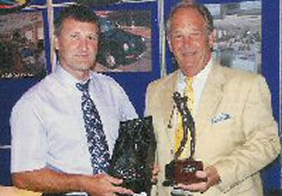 Brian Rice with Call Sign's Ray Scott and both his trophies