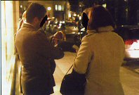 A female officer puts the cuffs a tout