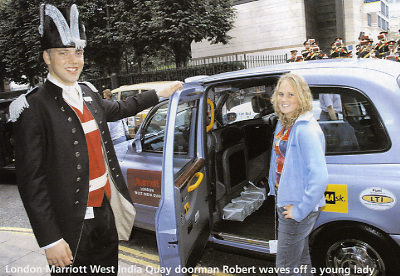 London Marriott West India Quay doorman Robert waves off a young lady