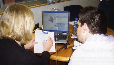 Daren Morley and Jill Ward check Daren's results