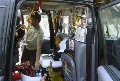 Customs men in Gibraltar are not used to seeing the inside of a London Cab.  Mind you, we've never seen one that looks like that either!