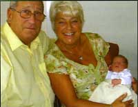 Mike Son and Wife with Grandchild Elliot