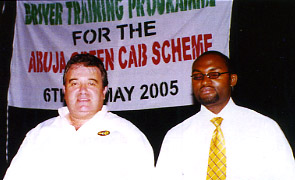 Tony with Project Manager Paul Santus. Even in Nigeria Tony manages to dig out a DaC top!