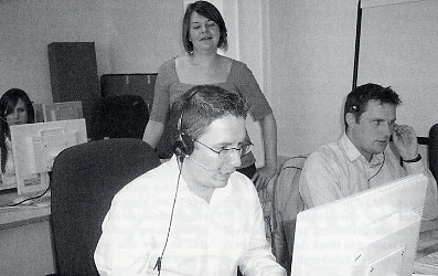 Christina in the DaC trianing room overlooking some trainee call takers