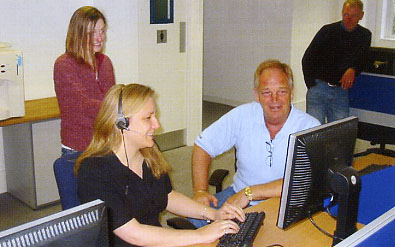 A piece of history as Becci dispatches the first trip.  Brian Rice, Theresa Whitfield & John Bankes look on.