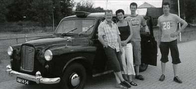 Hans and Hetty at home in Holland with their London Taxi