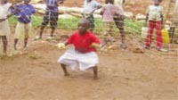 Inset pic: This young boy want to be goalkeeper and having no feet wont stop him...