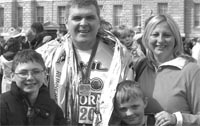 Phil Hannah with his proud wife and kids at the finish line