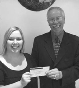 Nuala presents David Lessman with a 500 cheque on behalf of the drivers of Diala-Cab