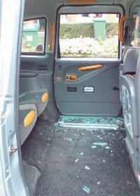 Broken glass covers the passenger compartment where the drunken female kicked the window out