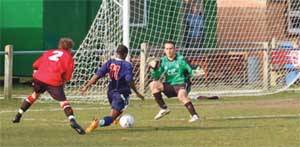 Bedfont Green’s Chris Henry scores against Sandhurst Town Pic Stewart Cook