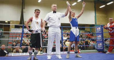 Sams hand is raised in victory as he moves onto the ABA Finals and his chance to box for England
