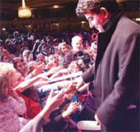 Eastenders ‘Nasty Nick’ (John Altman) says hello to some now-happy kids who had just booed his character!