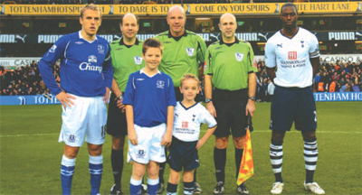 Harry’s Big Day! Captains Ledley King (o/r) and Everton’s Phil Neville. Harry is the mascot in white