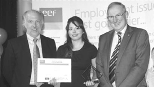    Sophia Lock is congratulated by David Richards, chairman of Prodrive and Aston Martin (left) and Barrie Williams, President of EEF in the West Midlands. 