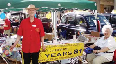 LTFUC Life President, Bill Tyzack, with wife Grace take their turn at minding the stall...