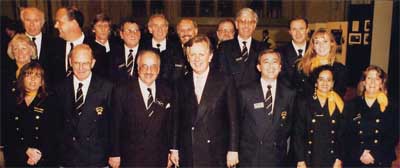 Steven Norris poses with ODRTS Board and staff at the Guildhall