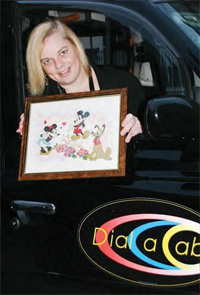 Fiona with her hand-made Disney cross stitch picture