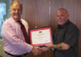 The Chairman presents Steve with his certificate